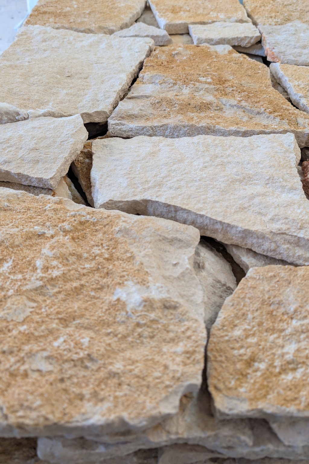 Sunset Beige Irregular Portuguese limestone with a natural split-face texture